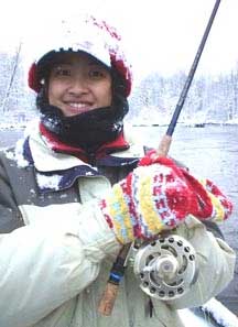 Theresa with a (lake effect) snow covered hat and a great smile, while fishing with this Salmon River blog guide in Pulaski NY.